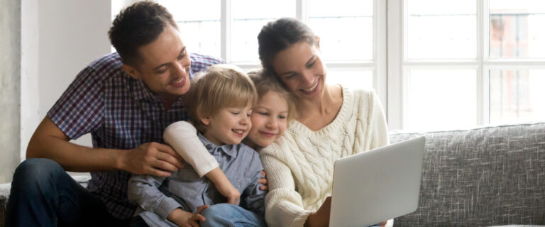 family looking on a laptop